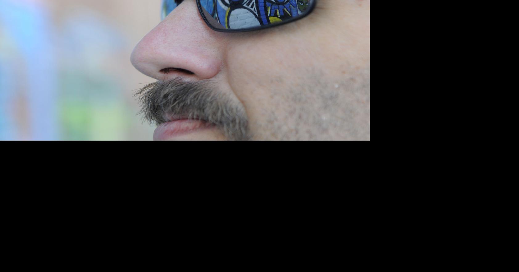 Artists work to convert graffiti to mural on Trade Street in WinstonSalem