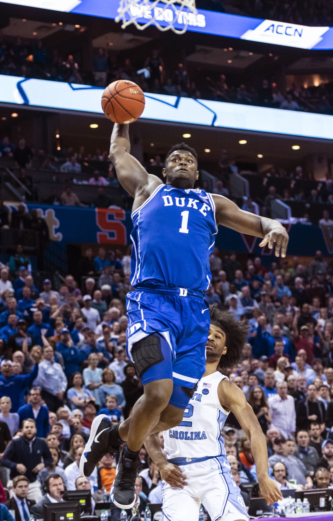 CHARLOTTE, NC - MARCH 16: Duke Blue Devils forward RJ Barrett (5) dunks  while Duke Blue Devils forward Zion Williamson (1) celebratess during the  2nd half of the ACC Tournament championship game