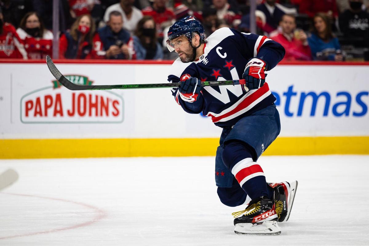 Alex Ovechkin receives mini trophies for winning Stanley Cup and being  named playoff MVP