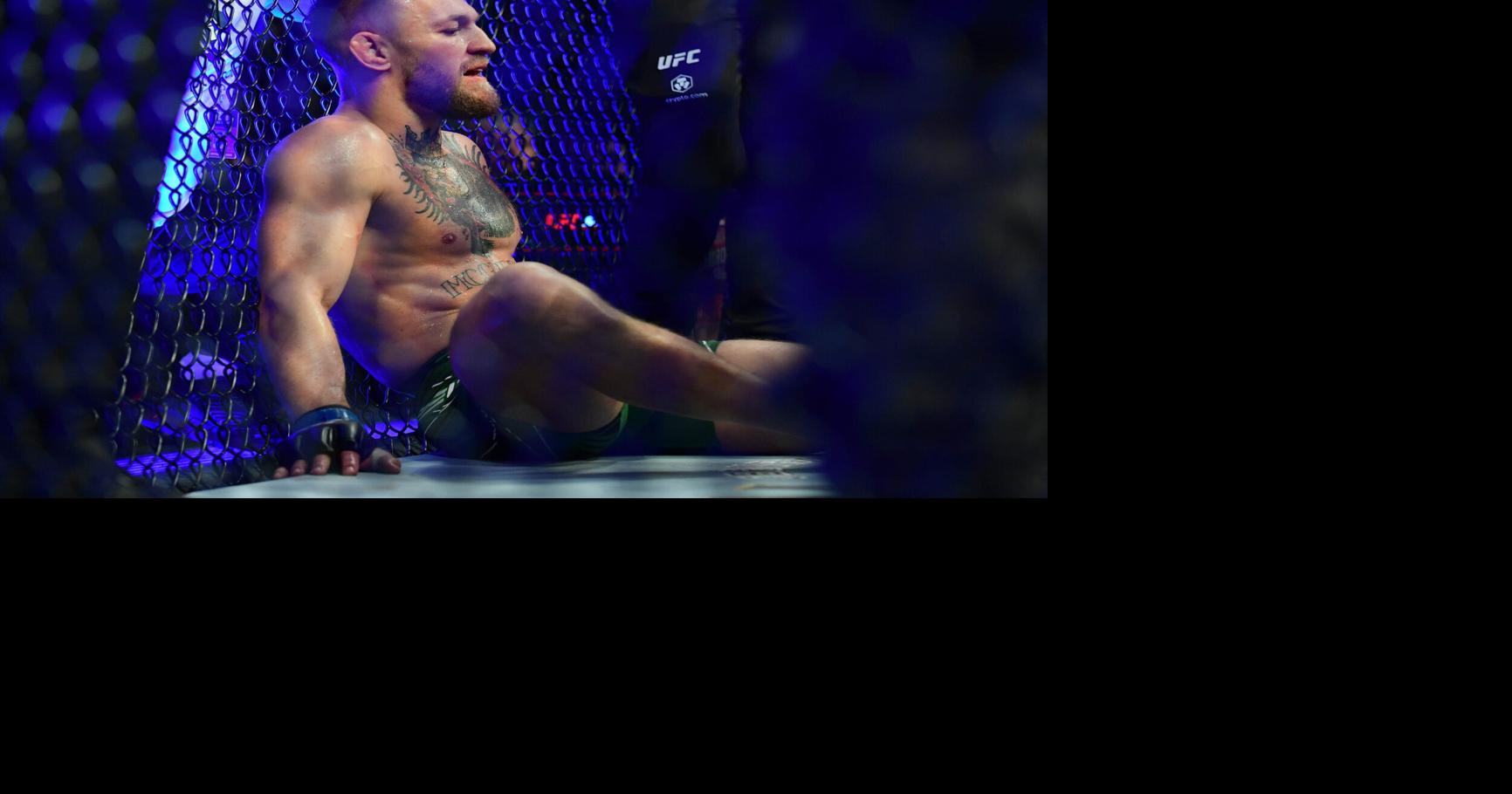 Conor McGregor reacts following an injury suffered against Dustin Poirier during UFC 264 at T-Mobile Arena in Las Vegas on July 10, 2021.