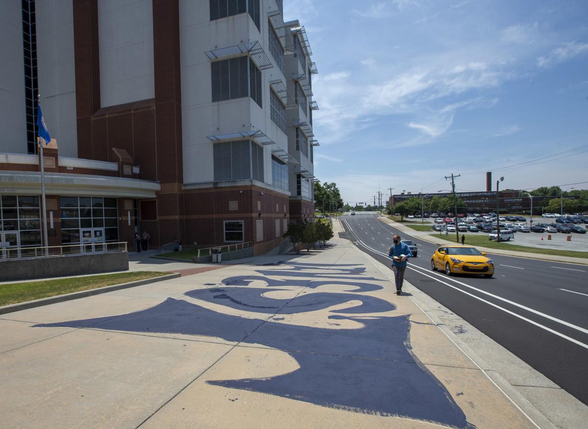 Divest Painting On Jail Sidewalk In Downtown Greensboro Leads To