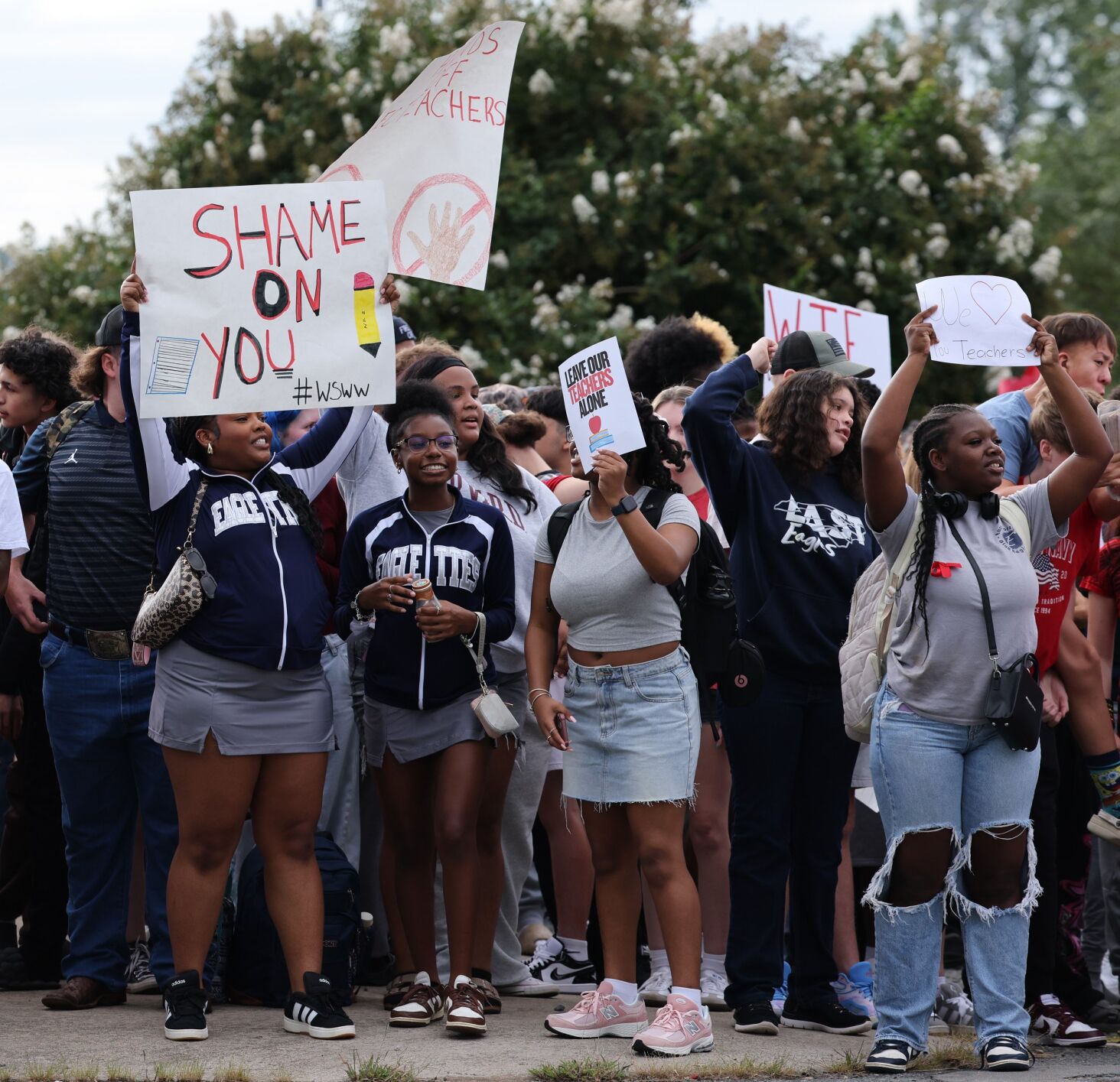 Forsyth County students stage walkout to protest job cuts