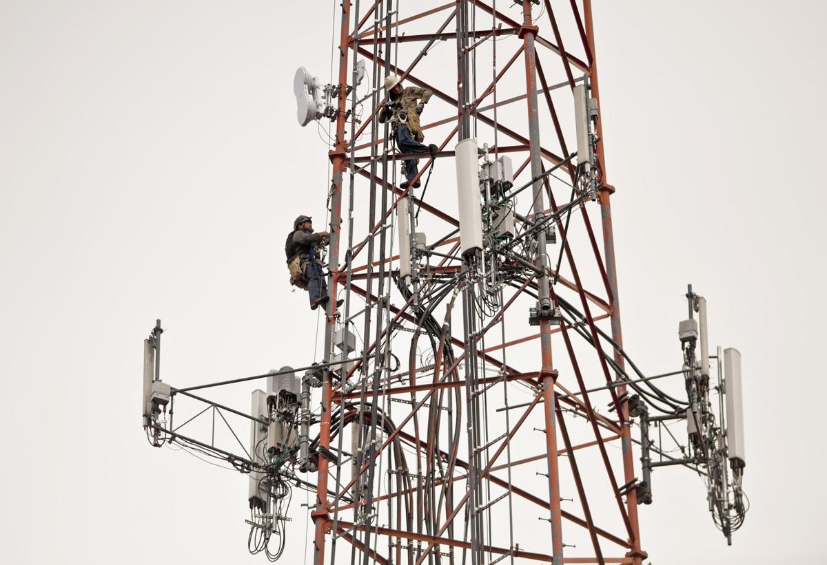 Workers remove body of man found hanging 400 feet up radio tower