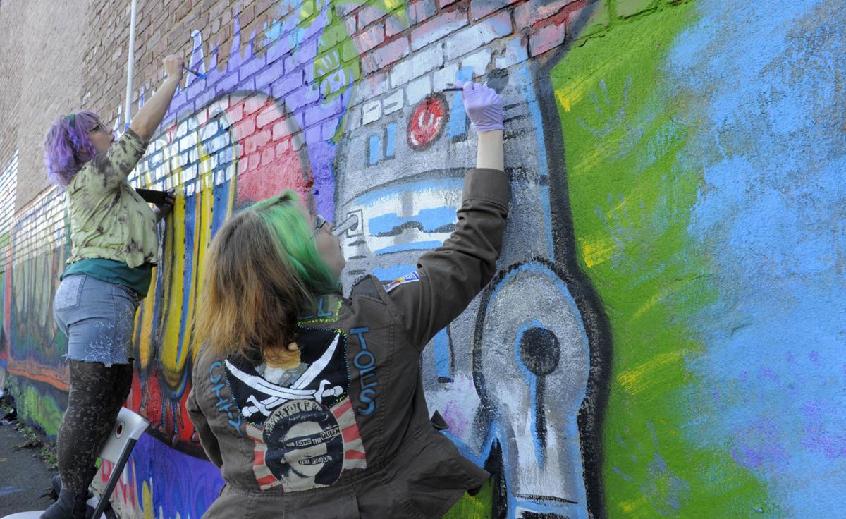 Artists Work To Convert Graffiti To Mural On Trade Street In Winston Salem Local News Journalnow Com