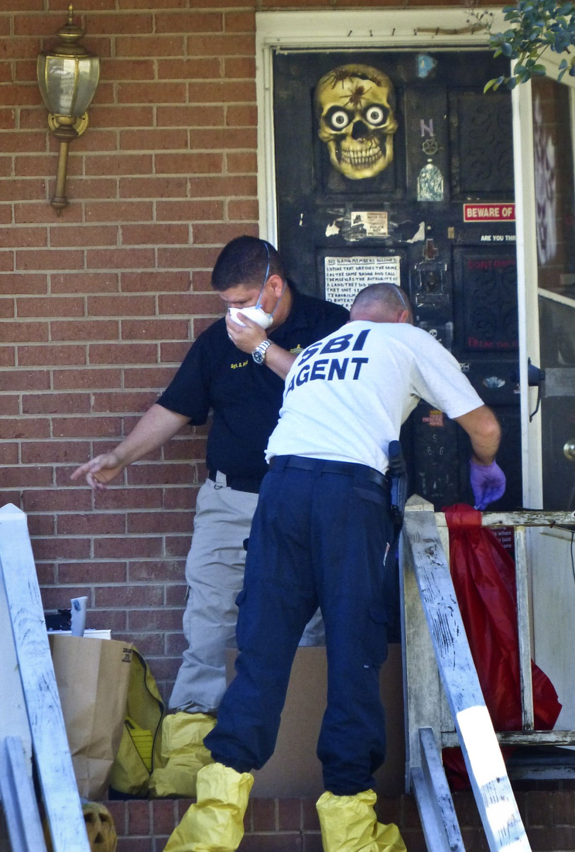 Bodies found in yard at Clemmons home