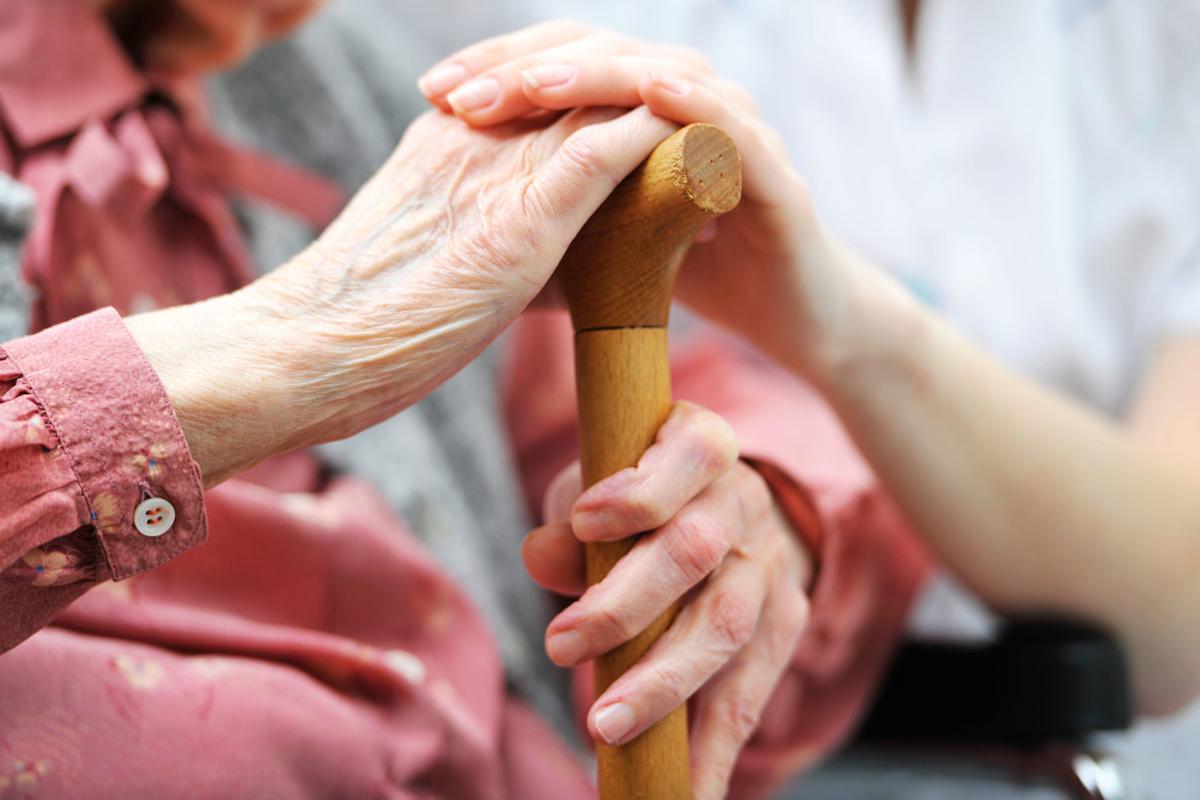 Senior woman with her caregiver at home WEB ONLY