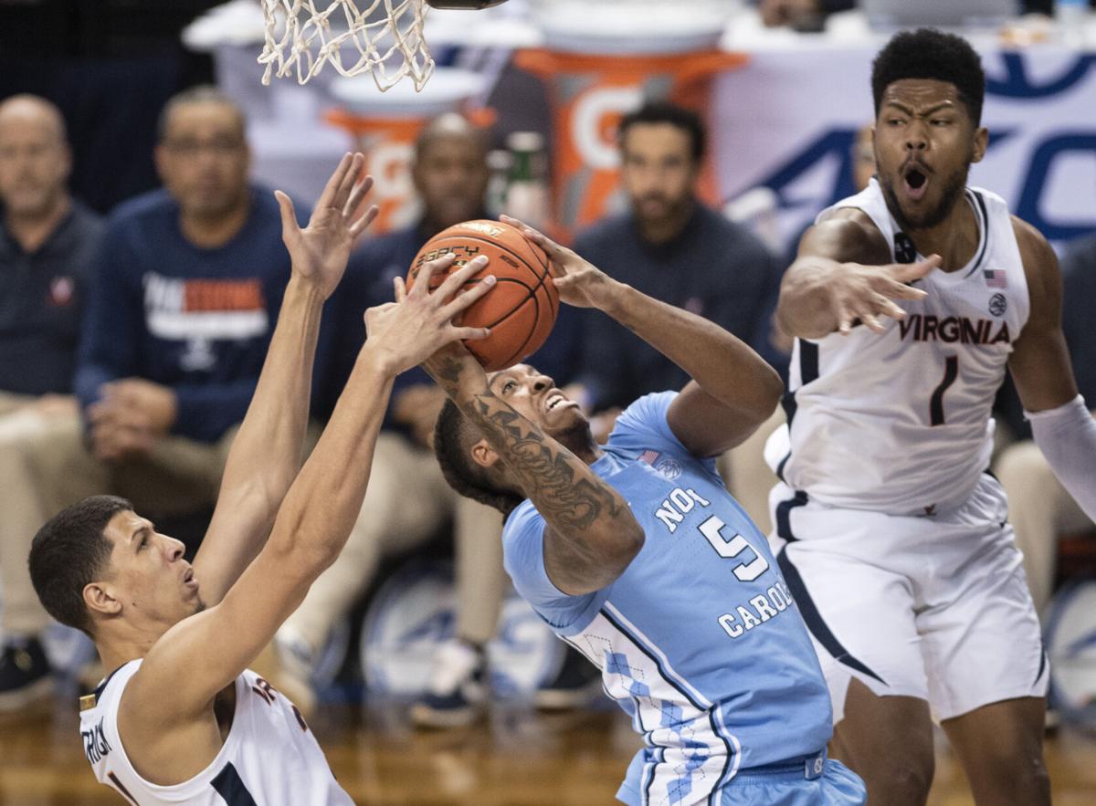 March 9, 2023: North Carolina State Wolfpack guard Jack Clark (5) knocks  the ball away from