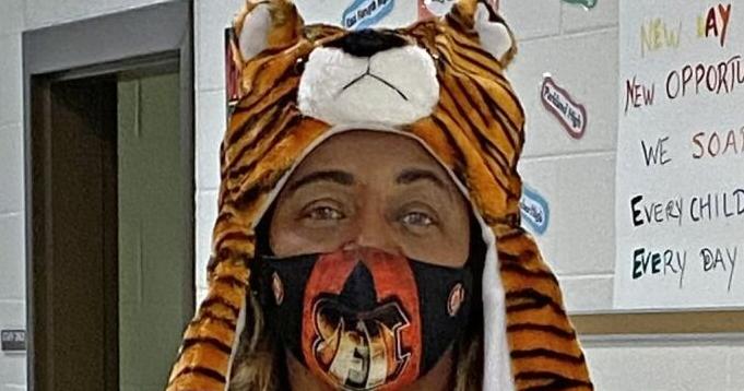 Fans of Mrs. Davis: Flat Rock staff wears colors of the Bengals in support of day porter