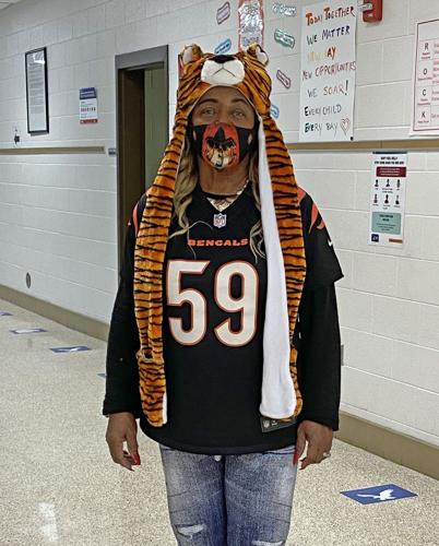 Fans of Mrs. Davis: Flat Rock staff wears colors of the Bengals in