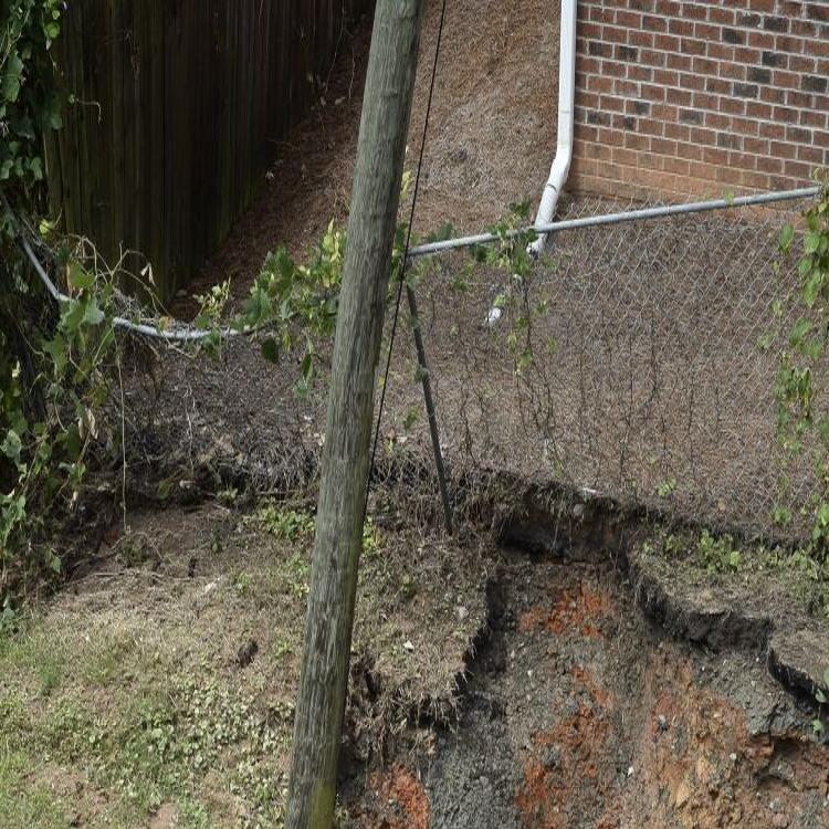 Storm Leaves Sinkhole Near Building In Downtown Winston Salem