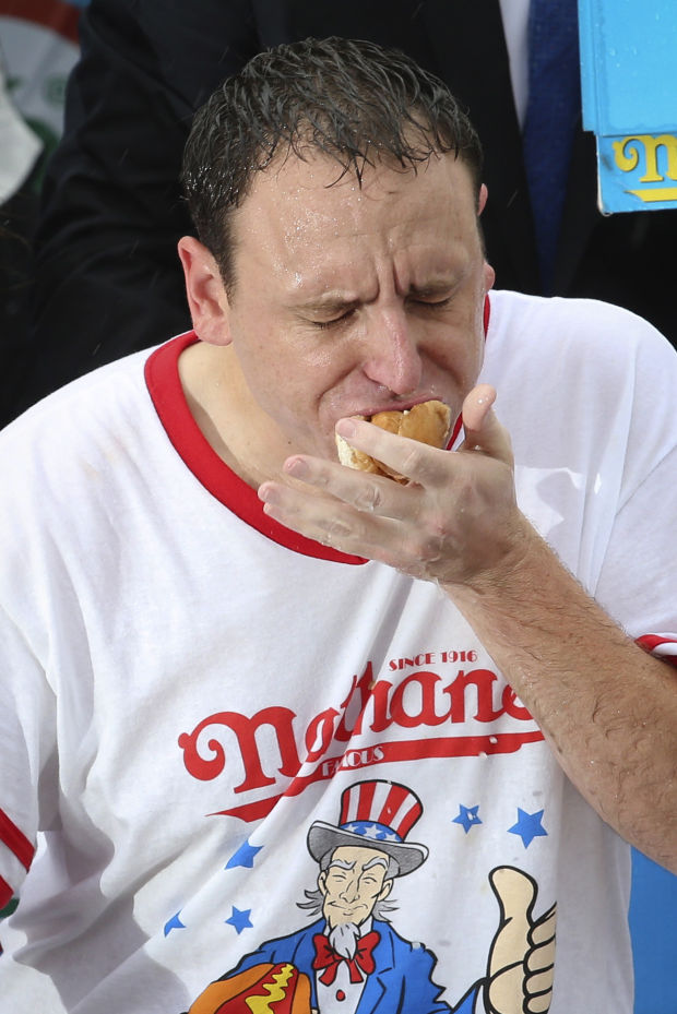 Joey Chestnut gets mustard yellow belt and fiancee National