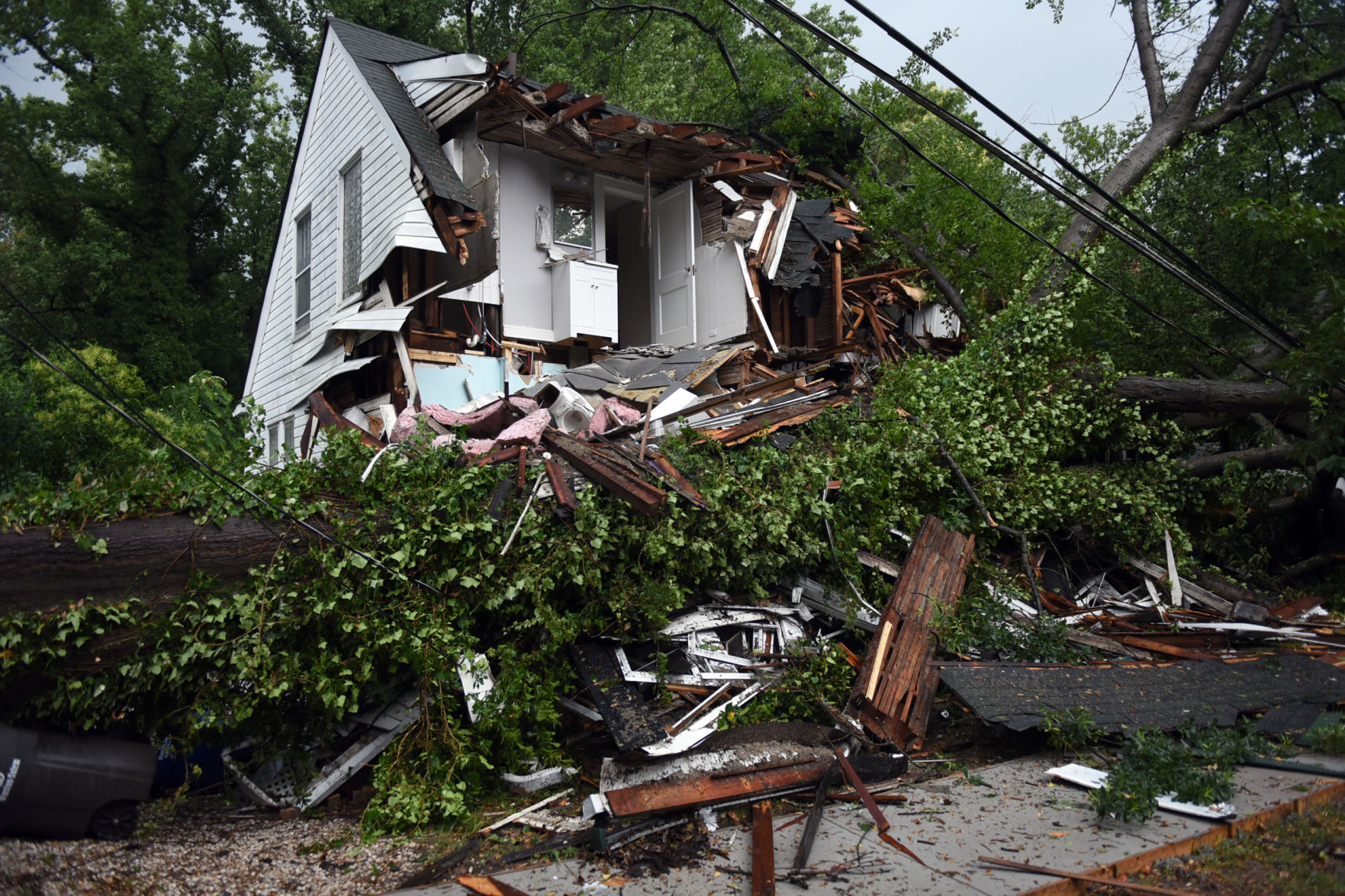 Tree falls on house in Winston-Salem as heavy rain falls across