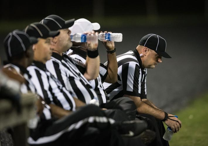 How is the color of a referee's uniform defined, in soccer matches