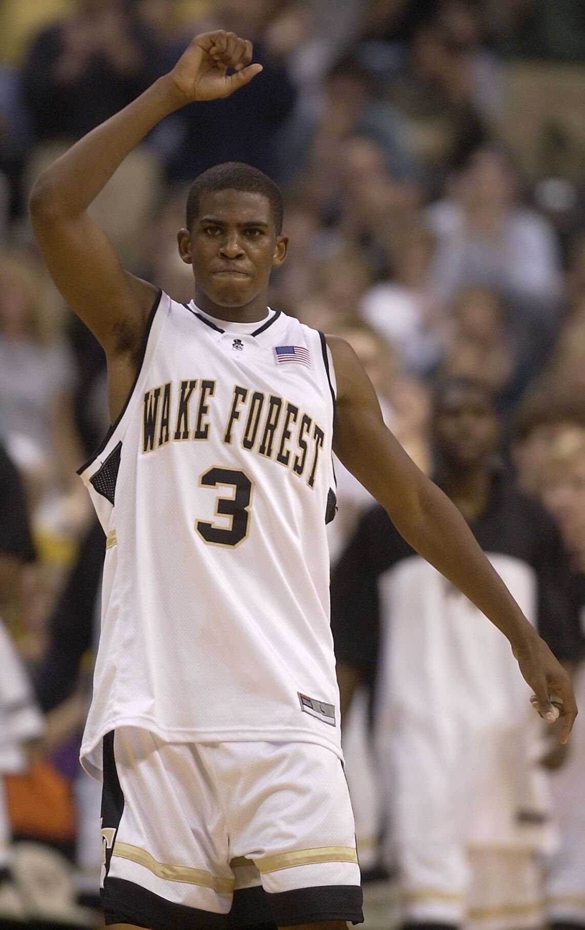 FILE - In this March 2, 2013, file photo, Los Angeles Clippers' Chris Paul  shows his Wake Forest jersey to fans as the school retired his number  during a ceremony at halftime