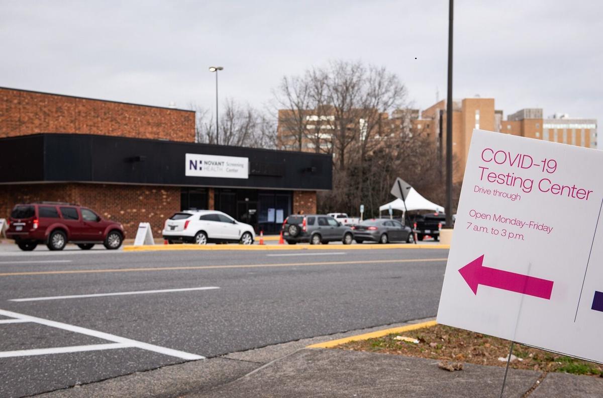 People wait in line for a COVID-19 test at a Novant Health testing center on Monday, Dec. 27, 2021, at 190 Hanes Mall Circle in Winston-Salem, N.C. (Allison Lee Isley, Journal) 122821-wsj-nws-covid