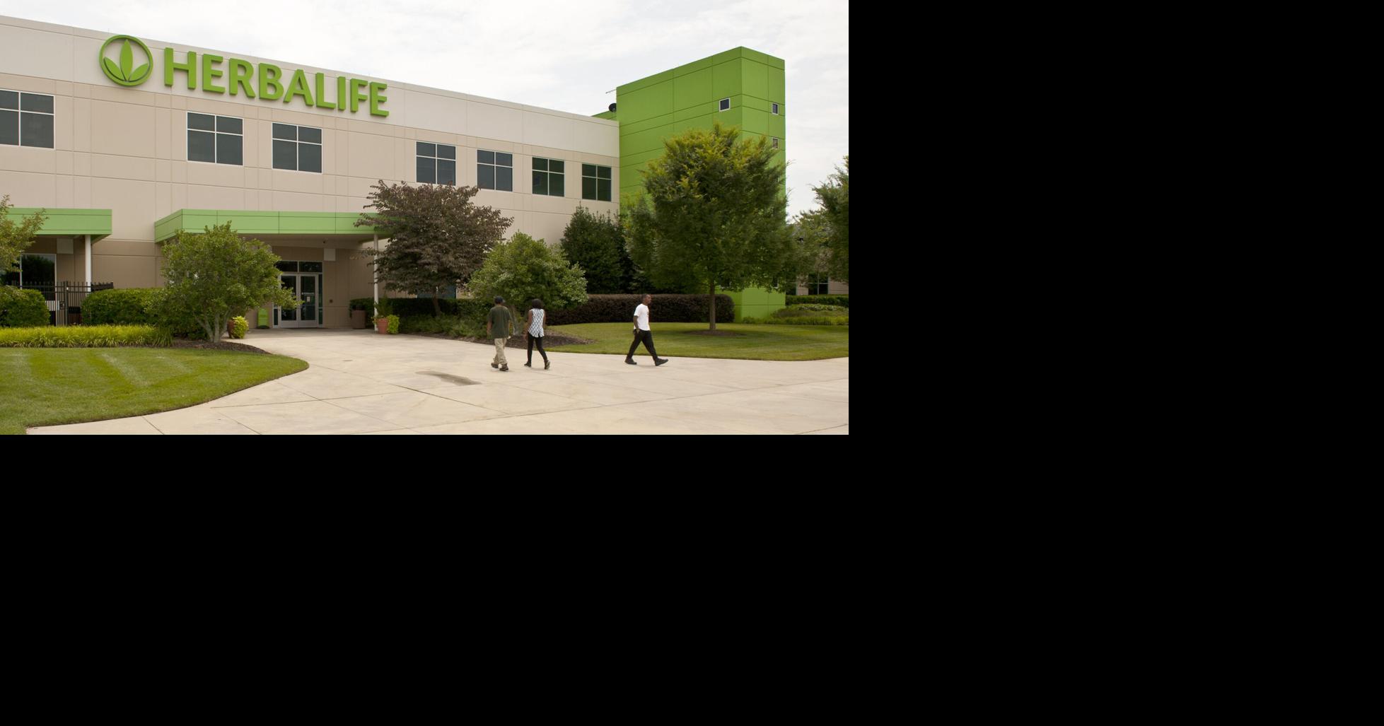 Herbalife reports quarterly loss after paying off debt early