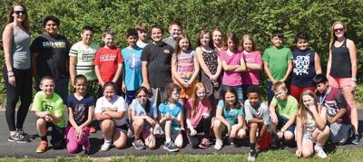 MORAVIAN FALLS ELEMENTARY "Girls on the Run" and "Let Me Run" participants are pictured with their coaches, Caitlin Pitkin, boys assistant coach, left and Belinda Marino, right, girls head coach. Not pictured is Sara Webster, boys head coach.