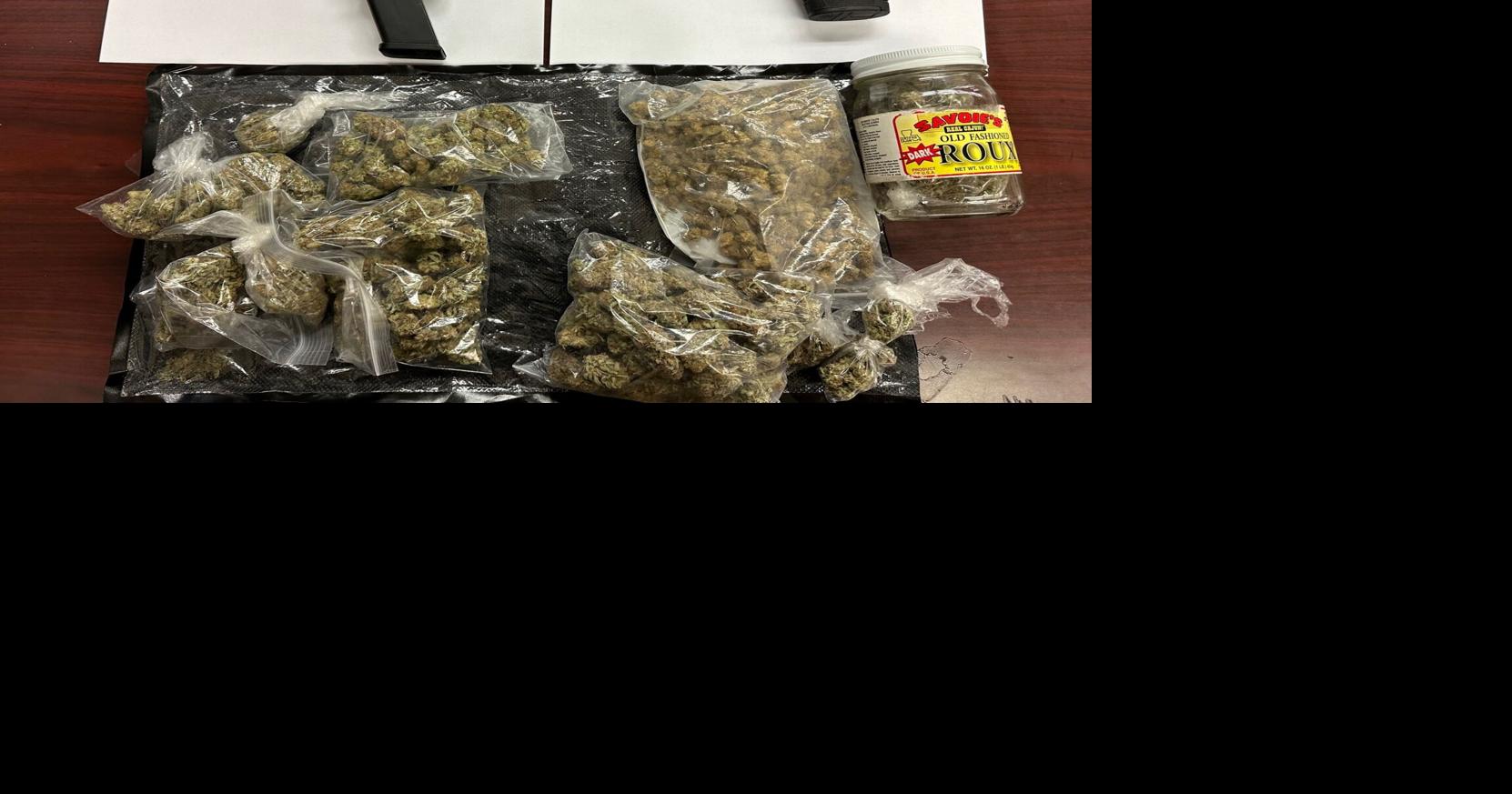 Pair of convicted felons found carrying guns, arrested for drug dealing