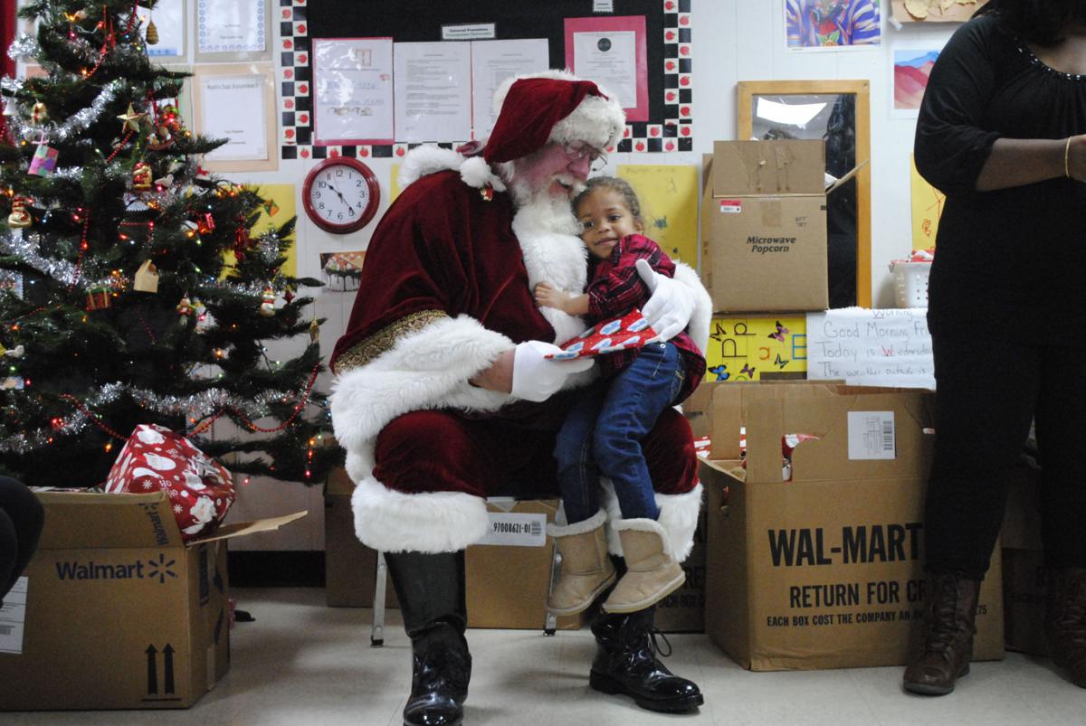 Santa brings magic of Christmas to Head Start children