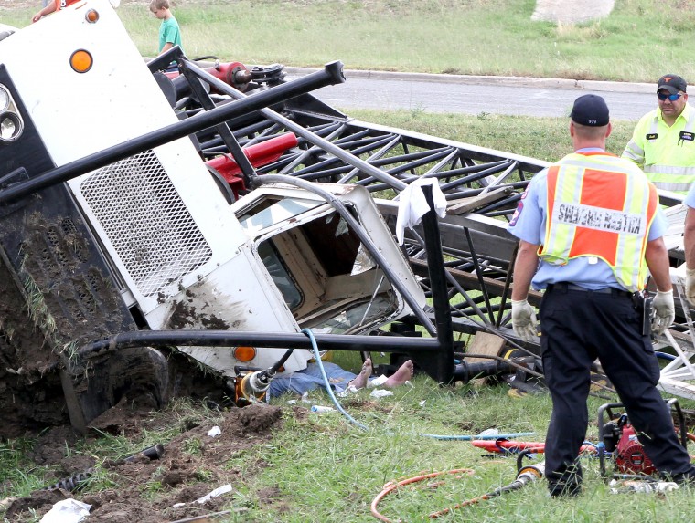 Overturned crane truck