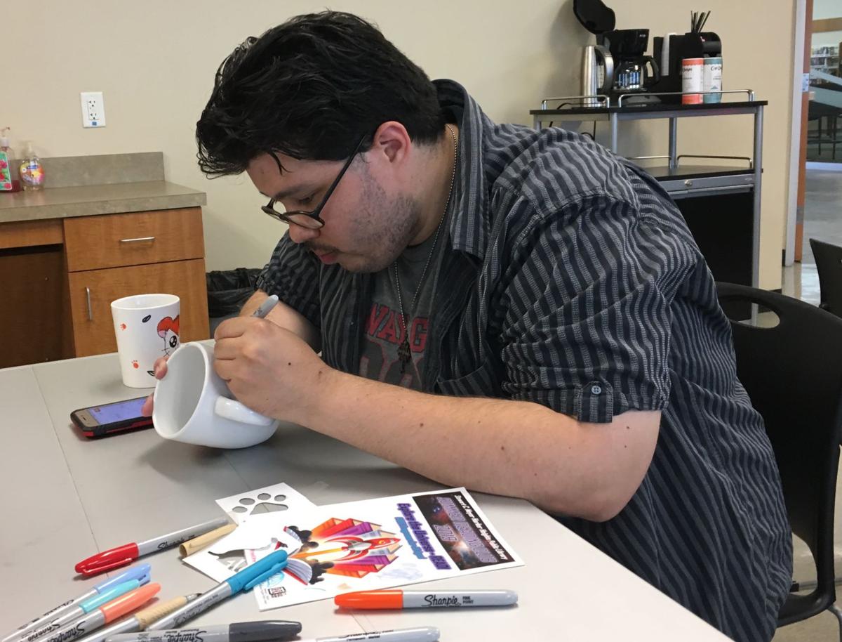 Library Attendees Turn Coffee Cups Into Art With Sharpie Pens