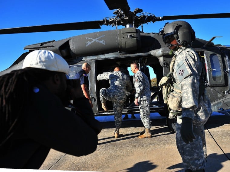 Sgt major Arthor Coleman climbs into blackhawk