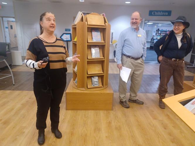 Local artists reveal art reflecting Cove history displayed at library