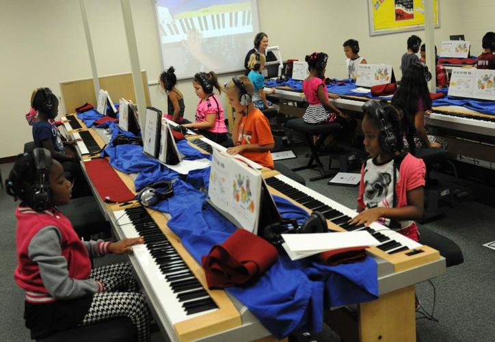 Skipcha Elementary students learning to play piano Community