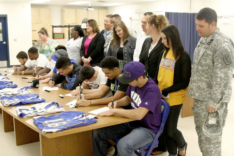 Eight Cove athletes sign letters of intent