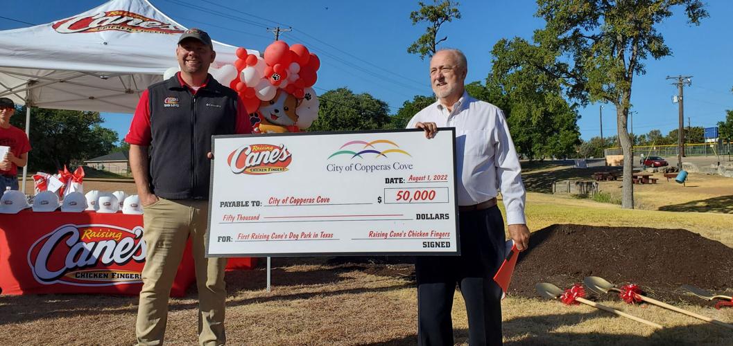 Raising Cane’s, city officials break ground on dog park in Cove