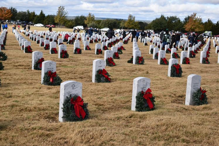 Hundreds turn out for laying of the wreaths at veterans cemetery