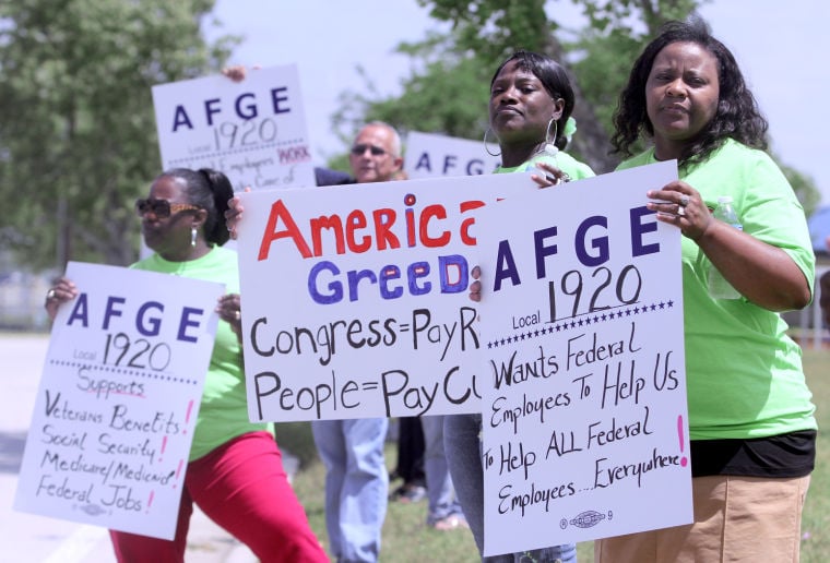 Civilian employees picket furloughs Military