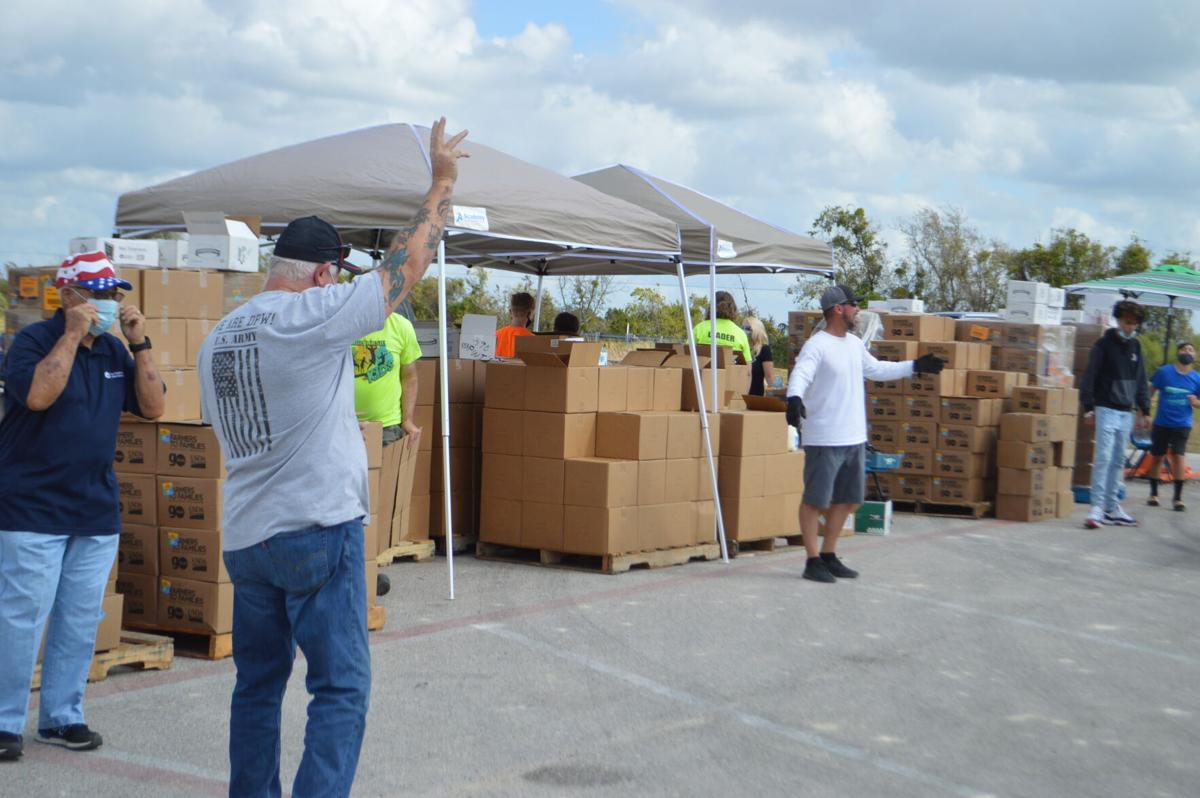‘Love just loves’ Cove church donates more than 1,000 boxes of food to