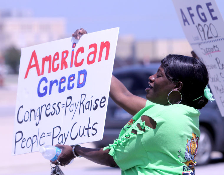 Civilian employees picket furloughs Military