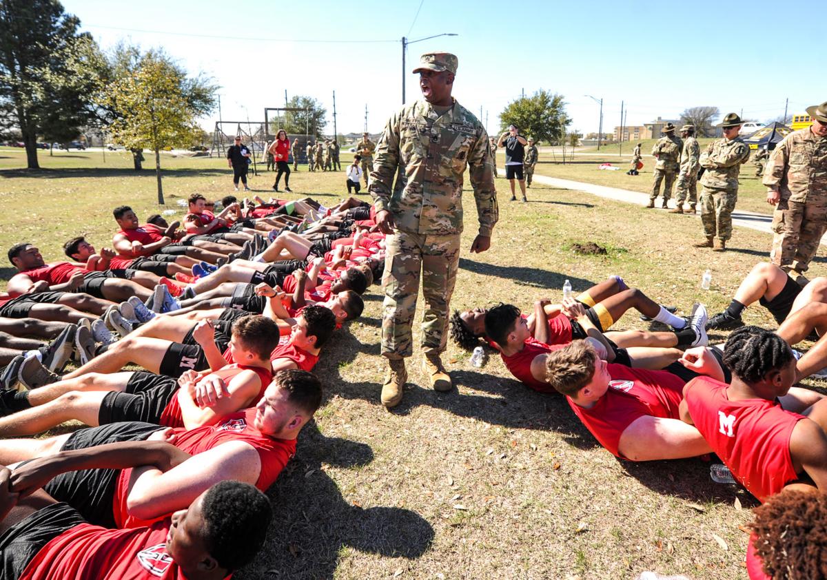 Military training Harker Heights football team drill at Fort Hood