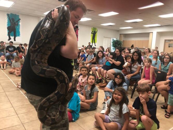 Local Kids and their families learn about reptiles at library