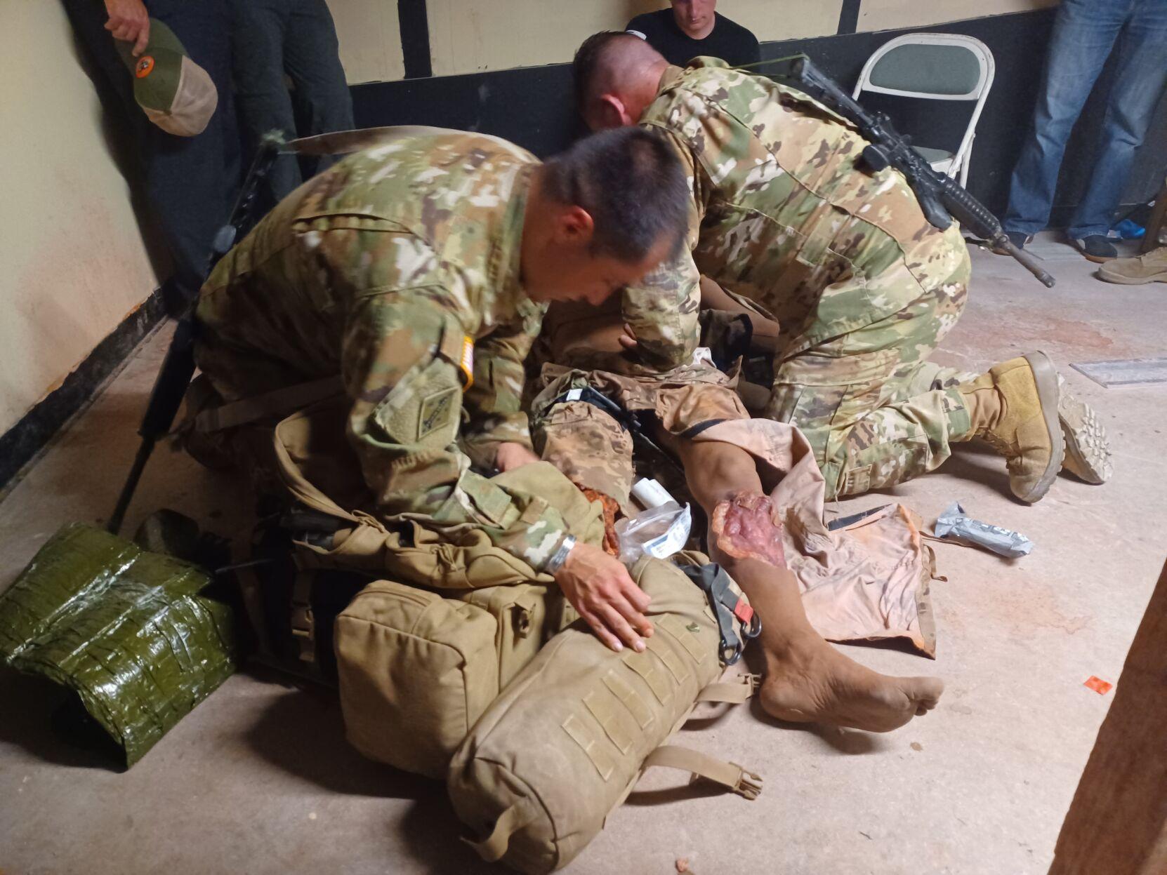 Staff Sgt. Todd Marchese, right, and Sgt. 1st Class Kurt Hogan, both flight medics with the Louisiana Army National Guard, simulate working on a medical dummy during a Joint Emergency Medicine Exercise hosted by Carl R. Darnall Army Medical Center on Fort Hood on June 7. The training is part of a week-long exercise for Tri-Service Military Residency Program students and medical personnel from Army, Navy and Air Force medical teams, including active duty, National Guard and Reserves to familiarize the different medical professions with what each job does in combat scenarios.
