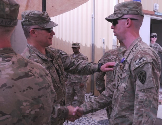 Military intelligence soldiers receive Purple Heart Medals | Across the ...