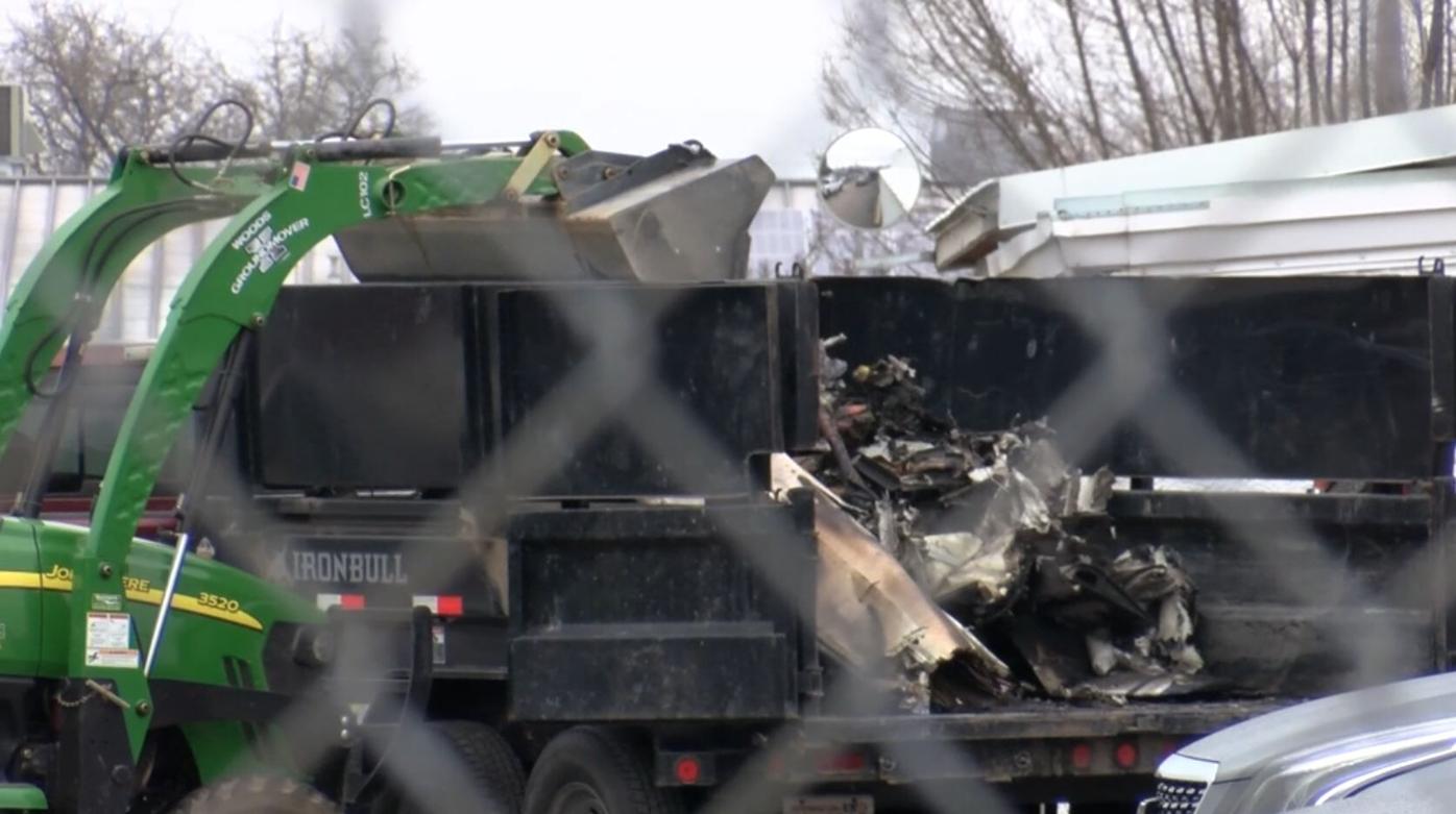 Federal investigators begin hauling away debris from deadly Medford plane crash