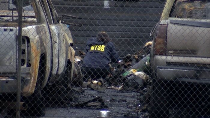 Federal investigators begin hauling away debris from deadly Medford plane crash
