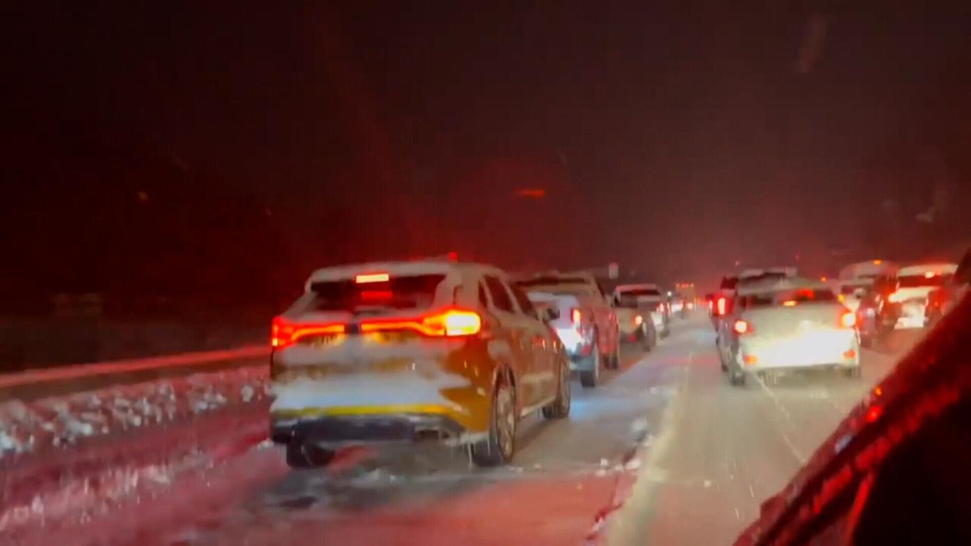 Winter weather in Kentucky halts roadways as authorities work to clear a pile-up with over 20 vehicles