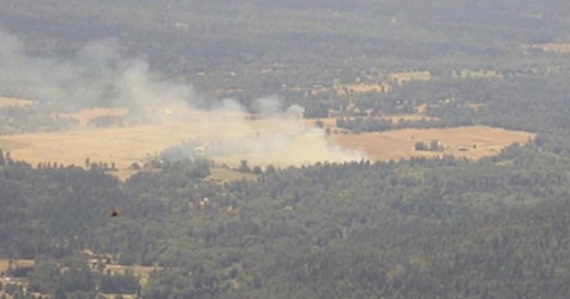 Crews create wet line for Holland Loop Fire, stop flames from spreading ...