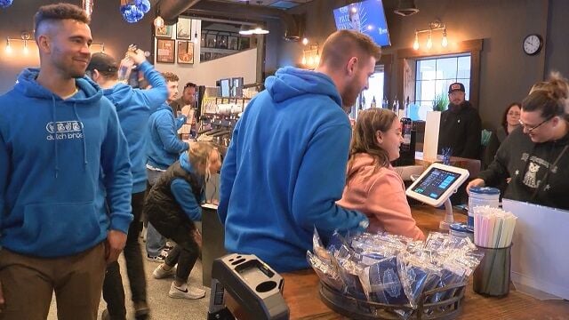 Dutch Bros employees & Make-A-Wish Alumn Allision Johnson working to serve orders.jpg