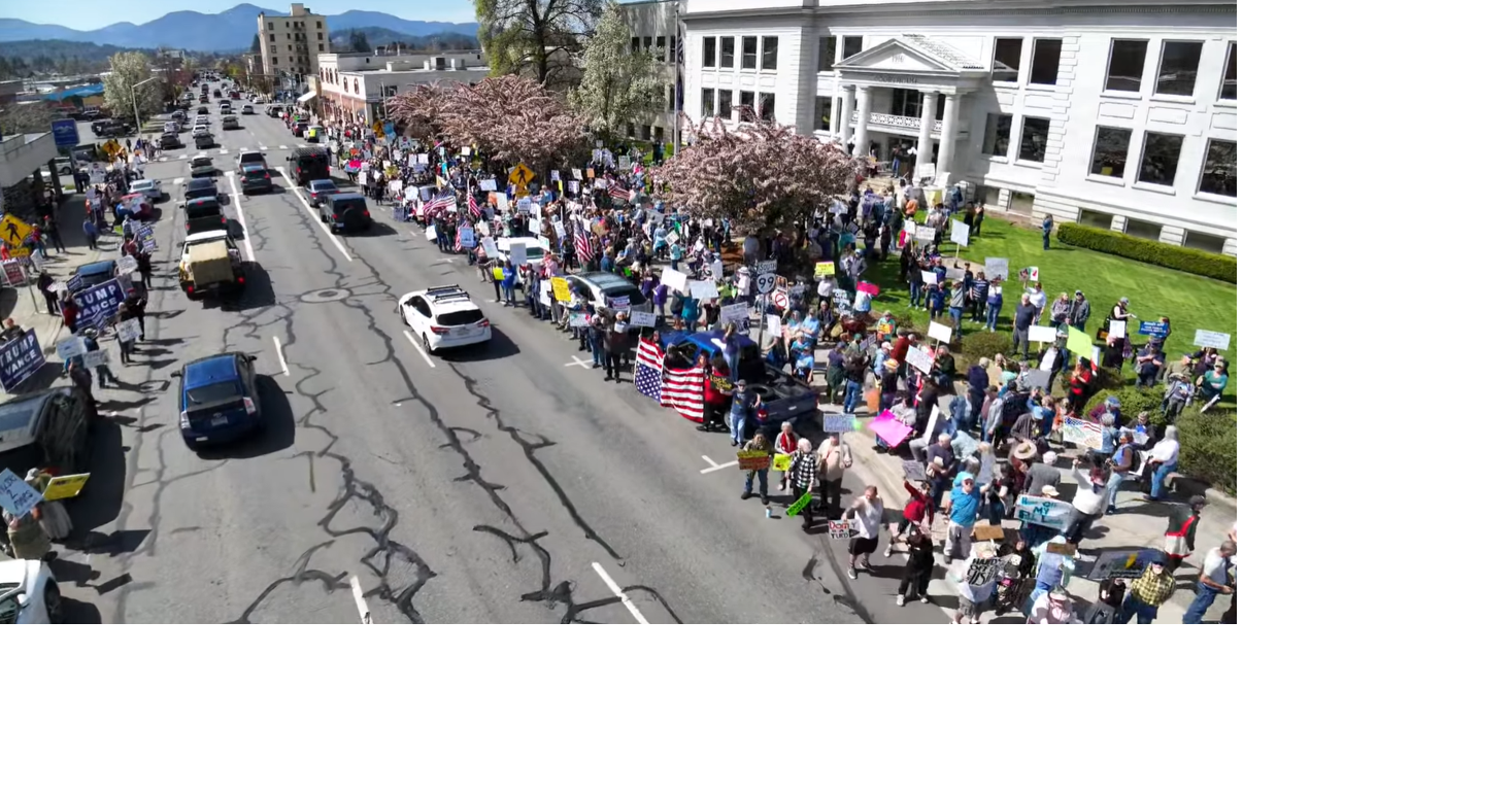 Grants Pass protesters rally against federal cuts and policies | News ...