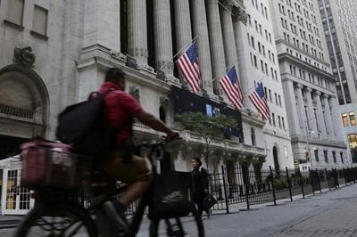 Wall Street ends lower as global central banks raise rates