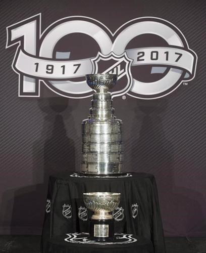 NHL Ceremony - Stanley cup trophy on the black stand, white