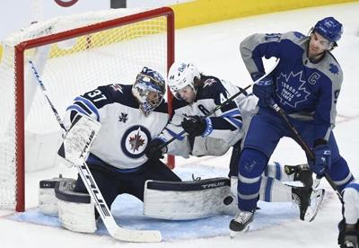 Connor Hellebuyck makes 36 saves as Jets down Maple Leafs 4-3 | National Sports ...