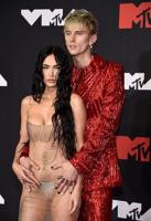 Machine Gun Kelly takes knee under tree, Megan Fox says yes