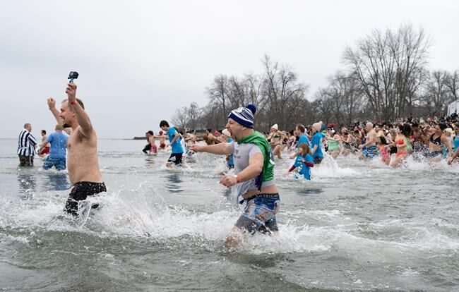 PHOTOS: Hundreds plunge into a frigid Okanagan Lake for a good cause