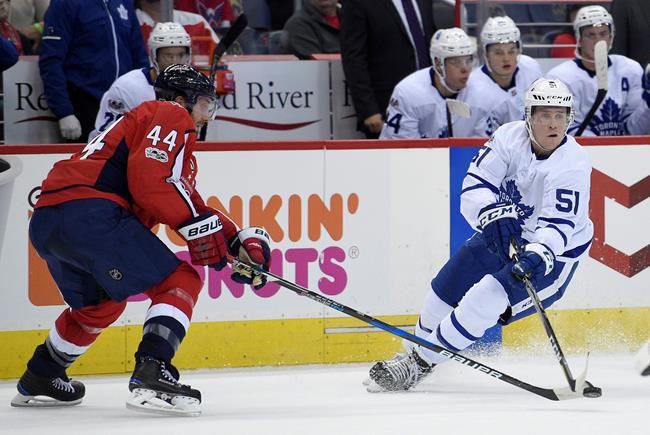 Tyler Bozak of the Toronto Maple Leafs and John Carlson of the